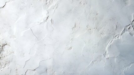 White wall with a rough texture. The wall is covered in cracks and has a rough, uneven surface