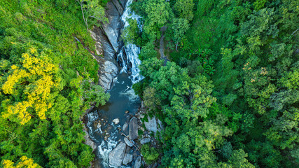 Mae Klang Waterfall in Chiang Mai.
A stunning aerial view of a cascading waterfall surrounded by...