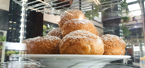 Custard cake, dessert bun Shu on display,flour product with cream, bakery.