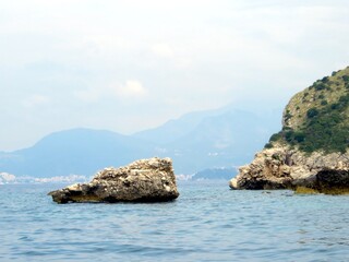 Exploring the Rocky Coast of the Adriatic Sea in Montenegro Under a Cloudy Sky