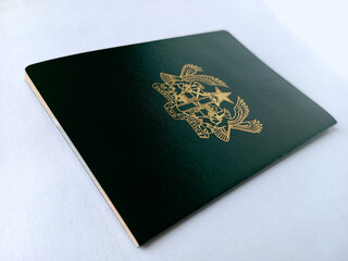 Back view of green Ghana travelling passport on white background. Document for travelling by air....