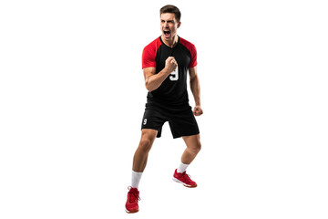 Male volleyball player in a black and red uniform cheering loudly with clenched fists