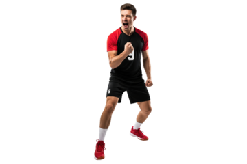 Male volleyball player in a black and red uniform cheering loudly with clenched fists