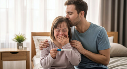 Overwhelmed woman with down syndrome crying of happiness holding positive pregnancy test and covering her mouth with her hand while her partner is kissing her forehead and embracing her