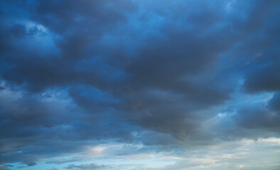 Beautiful bright sunset sky background with clouds. Evening time.