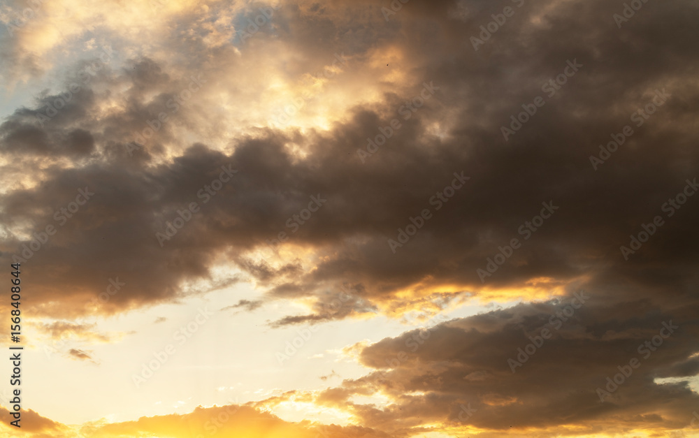 Wall mural beautiful bright sunset sky background with clouds. evening time.