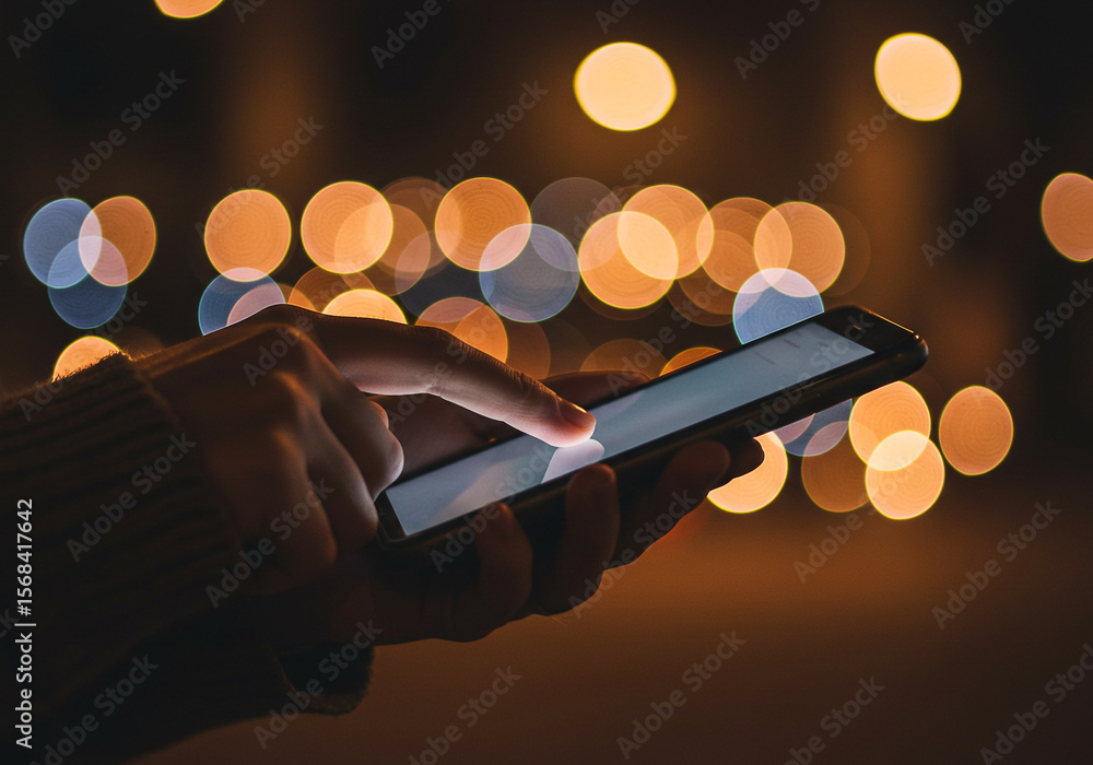 Aufkleber using smartphone at night bokeh background mobile technology social media apps communication device 