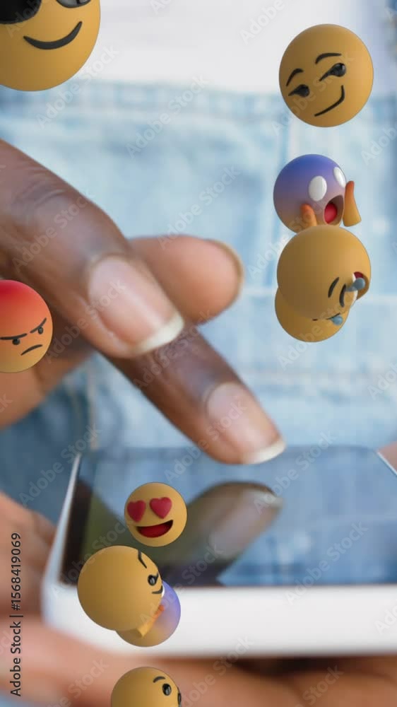 Poster animation of multiple face emojis floating over mid section of a woman using smartphone