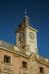Street photography in Alcala de Henares, Madrid, Spain. Mayor street (calle Mayor)  and main square.