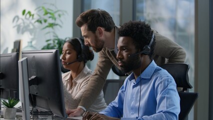 Callcenter teamwork multicultural office operators support communication African man Indian woman...