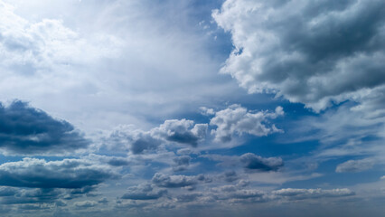 Beautiful cloud formation in a blue sky, depicting a dynamic and serene atmosphere. Ideal for...