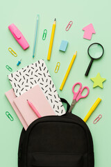 Creative Flat Lay of Educational Supplies and Backpack