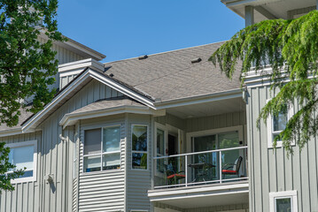 Top of modern apartment building with balcony, trees and beautiful landscape in Vancouver, Canada,...