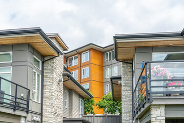 Top of modern apartment building with balcony, trees and beautiful landscape in Vancouver, Canada, North America. Day time on June 2025.