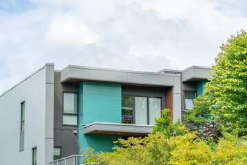 Top of modern apartment building with balcony, trees and beautiful landscape in Vancouver, Canada,...