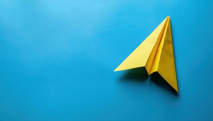 Yellow Paper Plane on Blue Background - Symbolizing Success in Business Growth