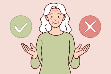 Elderly woman in light green top shows signs of heat exhaustion indoors. She holds head and looks unwell in stuffy environment