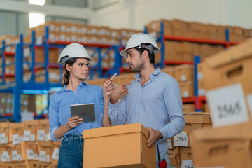 Warehouse worker working in warehouse storage. Foreman or worker work at factory site check up...