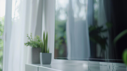 Sleek flat-screen TV displayed on minimalist white shelf, modern home entertainment and technology concept for living room interior design.
