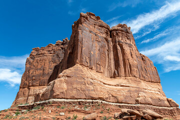 Multiple stone columns of The Courthouse Towers landmark geological formation at Arches National Park, Moab, UT, USA