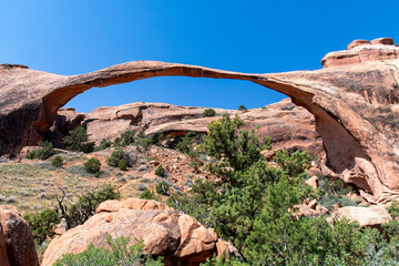 Low angle view of the Landscape Arch with longest sandstone span along Devils Garden Trail in Devil’s Garden district in Arches National Park, Utah, USA