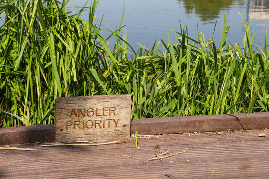 Fishing Spot with "Angler Priority" Sign at Lakeside