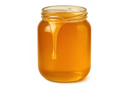 Honey dripping from glass jar, revealing golden liquid's rich color and silky consistency against transparent backdrop
