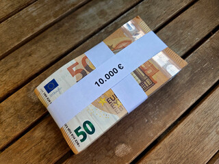 Euro currency bundle on wooden background for financial concepts and business design. Horizontal...