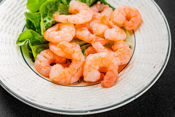 Shrimp salad prawns seafood fresh pescetarian diet gourmet food background on the table rustic food...