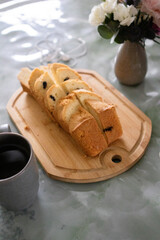 Sliced Bread and Cake on Wooden Cutting Board