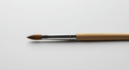 Naklejka premium The Tool of Creativity - A Minimalist Paintbrush
