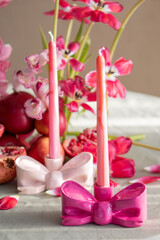 Festive Table Setting with Candles and Floral Decor