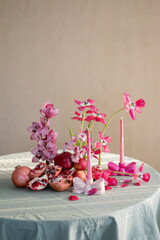 Festive Table Setting with Candles and Floral Decor