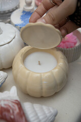 Pumpkin-shaped decorative candle for autumn or Halloween. High quality photo