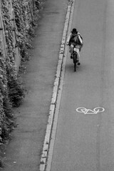 Cyclist Riding Along a Marked Path in an Urban Environment