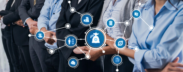 A group of business professionals collaborates in a corporate environment, focusing on innovative...