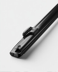 Black car wiper blade with aerodynamic design on white background