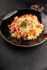 Rice meat and vegetables pilaf fresh delicious gourmet food background on the table rustic food top view copy space