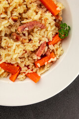 Rice meat and vegetables pilaf fresh delicious gourmet food background on the table rustic food top view copy space