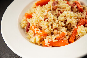Rice meat and vegetables pilaf fresh delicious gourmet food background on the table rustic food top view copy space