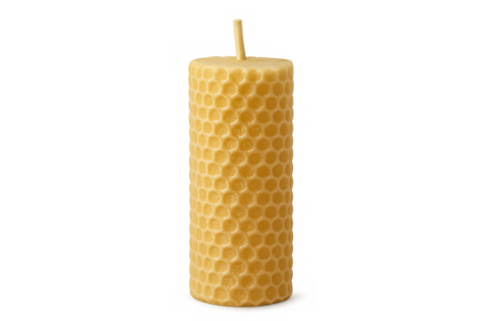 Beeswax candle with honeycomb texture standing vertically, featuring centered wick against transparent backdrop, awaiting illumination
