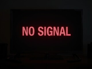 TV screen displaying 'NO SIGNAL' in a dark room, indicating connection or broadcasting issues.