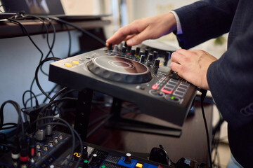 Witness the DJ mixing equipment performing live and in action at a vibrant music event