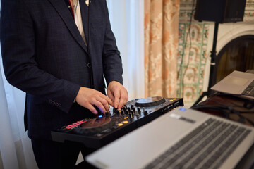 Witness the DJ mixing equipment performing live and in action at a vibrant music event
