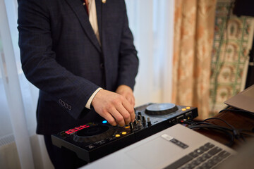 Witness the DJ mixing equipment performing live and in action at a vibrant music event