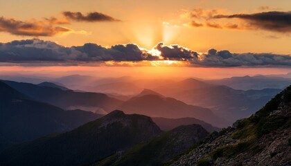 Obraz premium majestic landscape captured from a mountain peak featuring rugged terrain expansive hills and a vast sky filled with clouds highlighting the beauty of nature at sunset