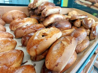 Freshly Baked Rolls Displayed in a Bakery at Midday