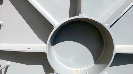 Flange Cover With Circular Opening Situated in Industrial Facility Under Bright Sunlight