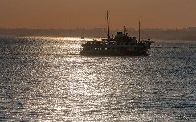Fototapeta premium Transportation from one side of Istanbul to the other by ship at sunset