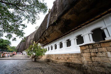 Dambulla Cave Temple entrance and rock exterior, historic Buddhist site and UNESCO World Heritage in Sri Lanka